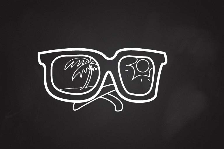 A drawing of sun glasses with a palm tree and a sun reflected in the lenses.
